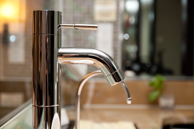 Leaking tap being repaired in Swiss Cottage